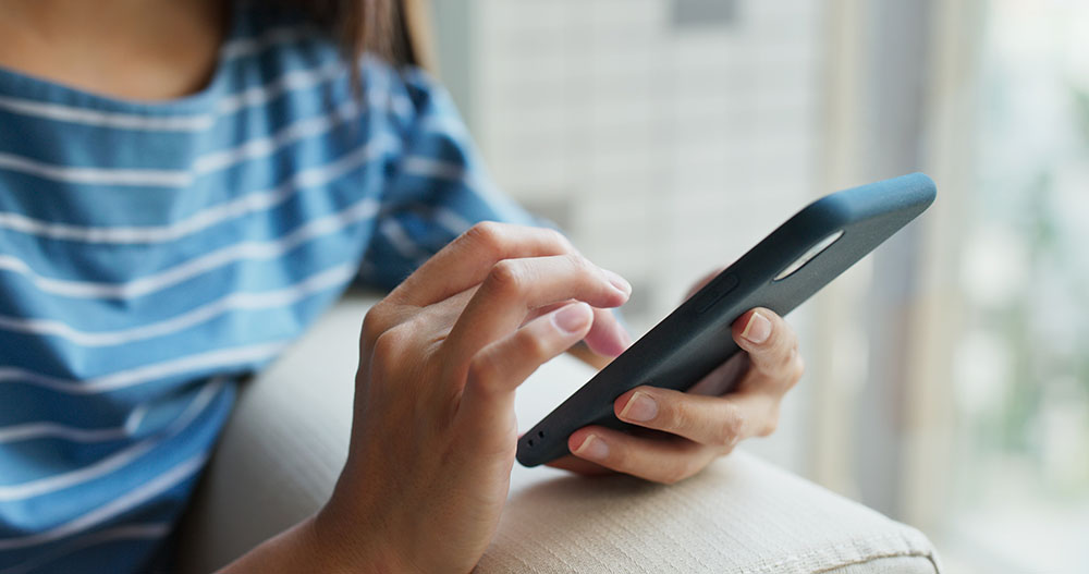 woman checking congregation website updates